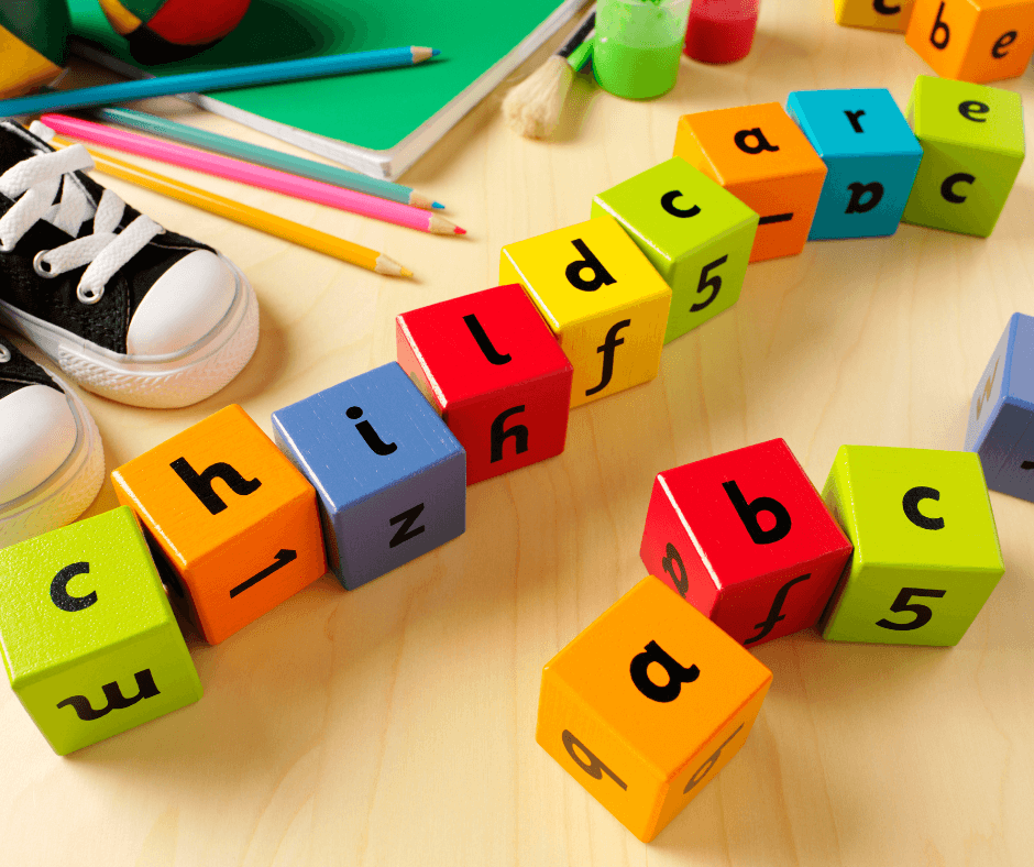 A line of different brightly coloured blocks with letters that spell out childcare